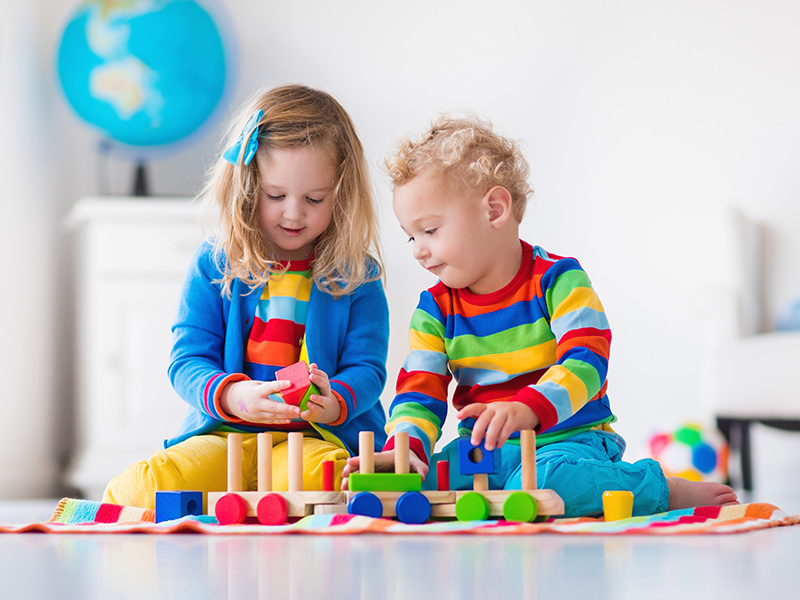 Kids Playing with Wooden Toys Kids Playing with Wooden Toys