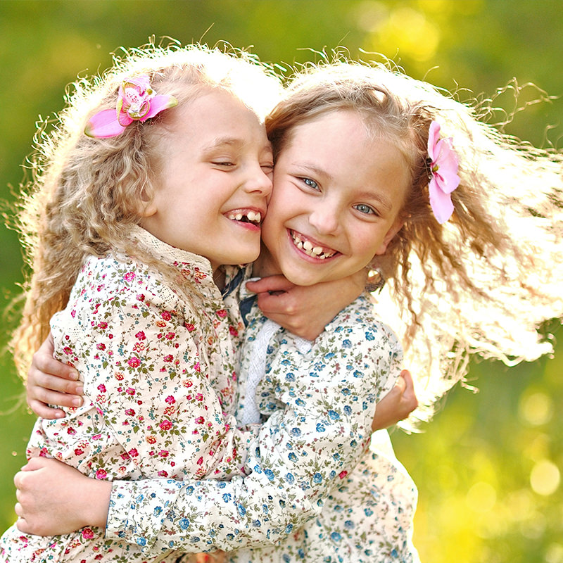 Twin Girls Smiling and Hugging Each Other 1 Twin Girls Smiling and Hugging Each Other 1