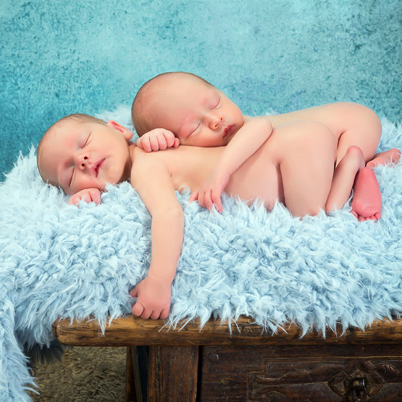Newborn Babies Laying on Fluffy Blanket 2 Newborn Babies Laying on Fluffy Blanket 2